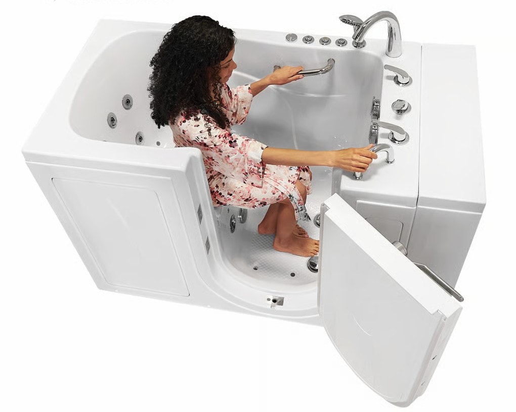 Woman demonstrating easy entry through the walk-in tub door with hydrotherapy jets visible