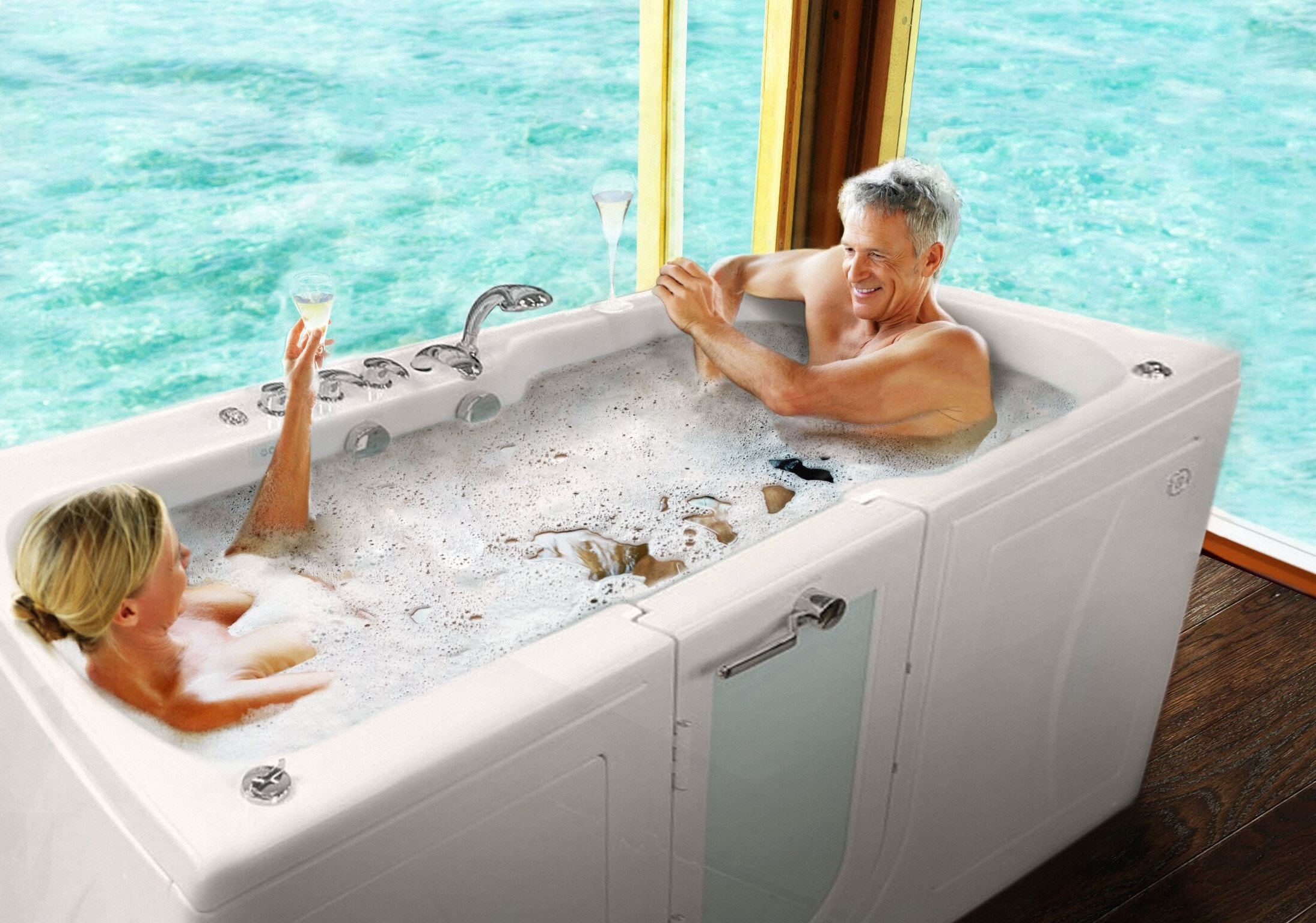 Senior couple enjoying a two-person walk-in tub together with marble surround