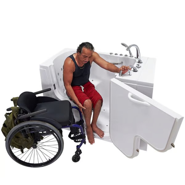 Man transferring from a wheelchair into an accessible walk-in tub with a wide door opening